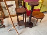 a small table and two stools in a room