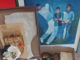 a box of sewing supplies on a table next to a framed picture