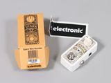 a box of electronic parts sitting next to an electronic device