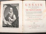 an old book with a picture of a man sitting on a chair