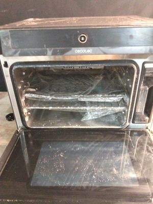 a silver oven that is sitting on top of a counter