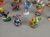 many figurines of different types and sizes on the table
