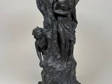 an image of a statue of a woman holding a child