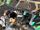 a close up of a motorcycle with a green and black design on it