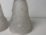 two salt and pepper shakers sitting on a table