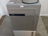 an image of a silver refrigerator sitting on top of a floor