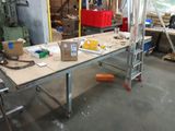 an image of a workbench in a workshop with tools on it