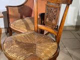 a wooden chair with a wooden seat and a wooden chair with a wooden seat