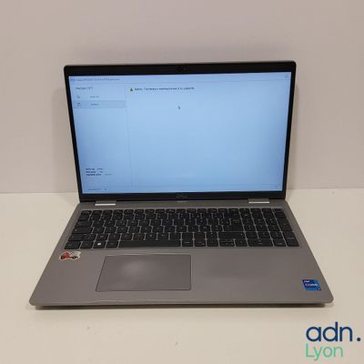 an open laptop computer sitting on top of a white table