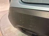 a close up of a car ' s bumper with scratches on it