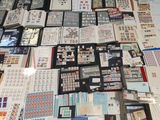 a lot of stamps and stamps on a table