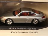 a silver toy car in a display case