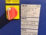 a close up of a switch on a blue wall