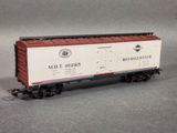 the toy train car is white and red with a red roof