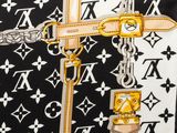 a close up of a purse with a chain on it