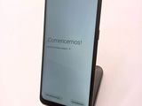 the back of a black samsung s9 phone with the screen open