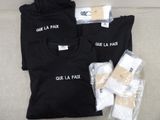 a black t - shirt with the words que la paix on it