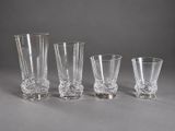three shot glasses sitting next to each other on a table