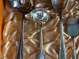 four spoons and two spoon spoons on the table