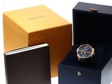 a box with a watch inside of it and a box with a watch inside of it