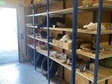 a room that has shelves with various items on them