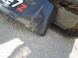 a close up of a motorcycle tire with a number plate on it