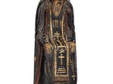 une image représentant la statue d'un homme à la longue barbe
