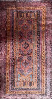 a close up of a rug on a wooden floor