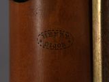 an image of a close up of a wooden object with a metal handle