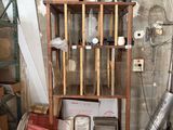 a wooden shelf with a bunch of items on top of it