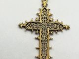 a gold cross on a white background