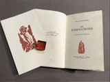 an open book with a picture of a dragon on it