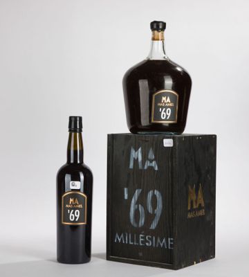 an image of a bottle and a bottle of wine on a table