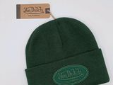 the hat is green and has a green patch on it