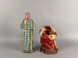 pair of ceramic figurines of a man and a woman