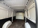 a white van with two beds in the back of it