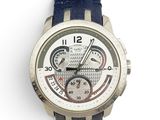 a close up of a watch on a white surface