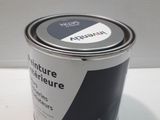 an image of a can of paint sitting on a table
