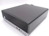 an image of a small black computer on a white surface