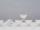 an image of a group of glasses sitting on top of a table