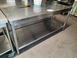 a stainless steel table with a bucket on top of it