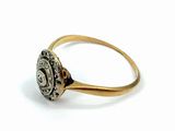 an image of a gold ring with a flower design on it