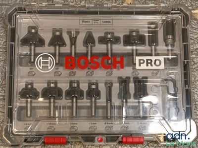 the box is full of various tools that include screws and bits