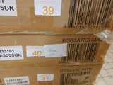 several boxes are stacked on top of each other on a tiled floor