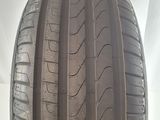 a close up of a car tire on a white surface