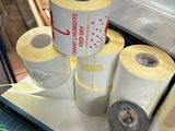 several rolls of paper sitting on top of a table next to a box