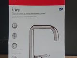 the box of the new faucet faucet is on the table
