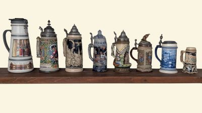 many different types of beer mugs on a shelf