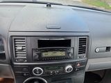 a dashboard of a car with a radio and a steering wheel