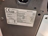a close up of a parking meter with a price label on it